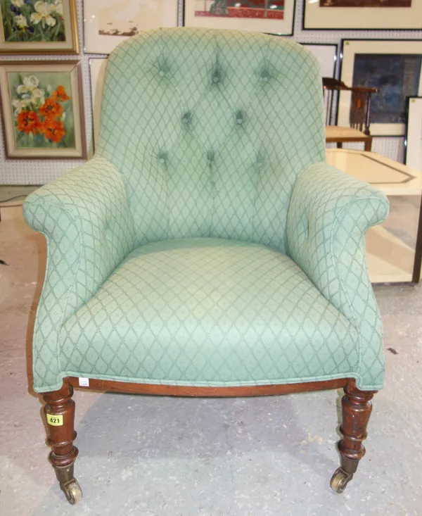 A Victorian mahogany framed easy armchair, with green upholstery.   B5