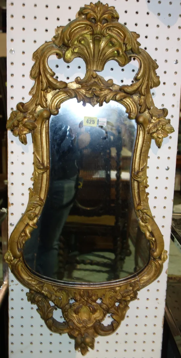 A 19th century gilt framed shaped wall mirror,with acanthus decoration, 42cm wide.  J6