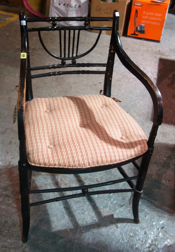 A Regency ebonised simulated bamboo armchair.   J4