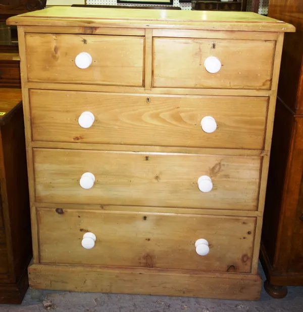 A 20th century pine chest of two short and three long drawers with ceramic handles, 92cm wide x 108cm high.   D8