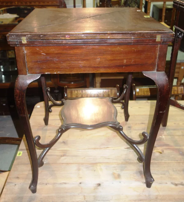 An Edwardian mahogany envelope card table with shaped undertier.   H6