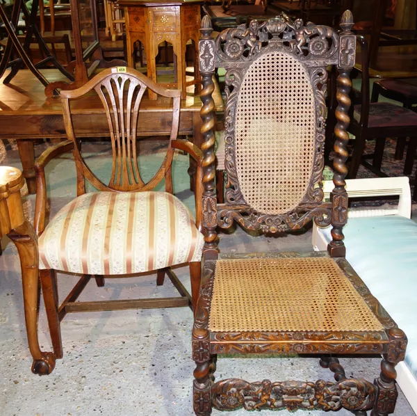 Two similar elm shield back carved chairs and a carved oak single chair with cane seat, (3).   I6