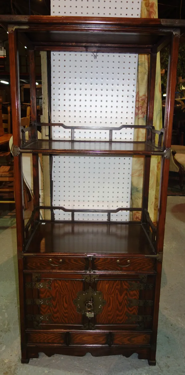 A 20th century Chinese hardwood whatnot with cupboard base, 67cm wide x 137cm high.   D5