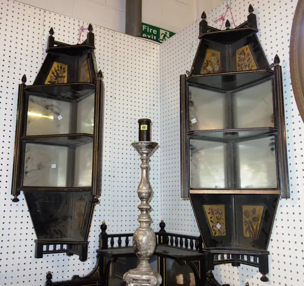 A pair of 19th century Aesthetic movement ebonised and gilt decorated mirrored corner shelves. M11