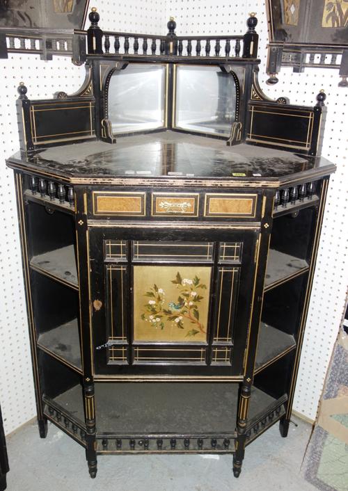 A 19th century Aesthetic movement corner cabinet, with mirrored galleried back and gilt decoration 93cm wide. K11