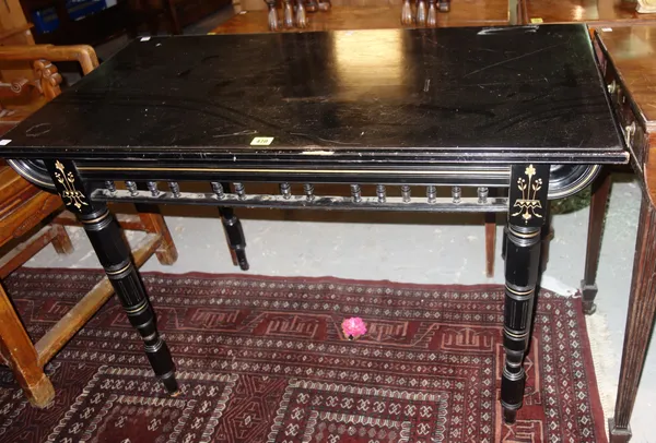 A 19th century Aesthetic movement ebonised side table, with gilt decoration and turned supports, 103cm wide. L10