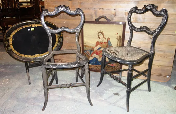 A pair of ebonised and mother-of-pearl inlaid bedroom chairs, an oval tray on stand and a fire screen, (3).  D10