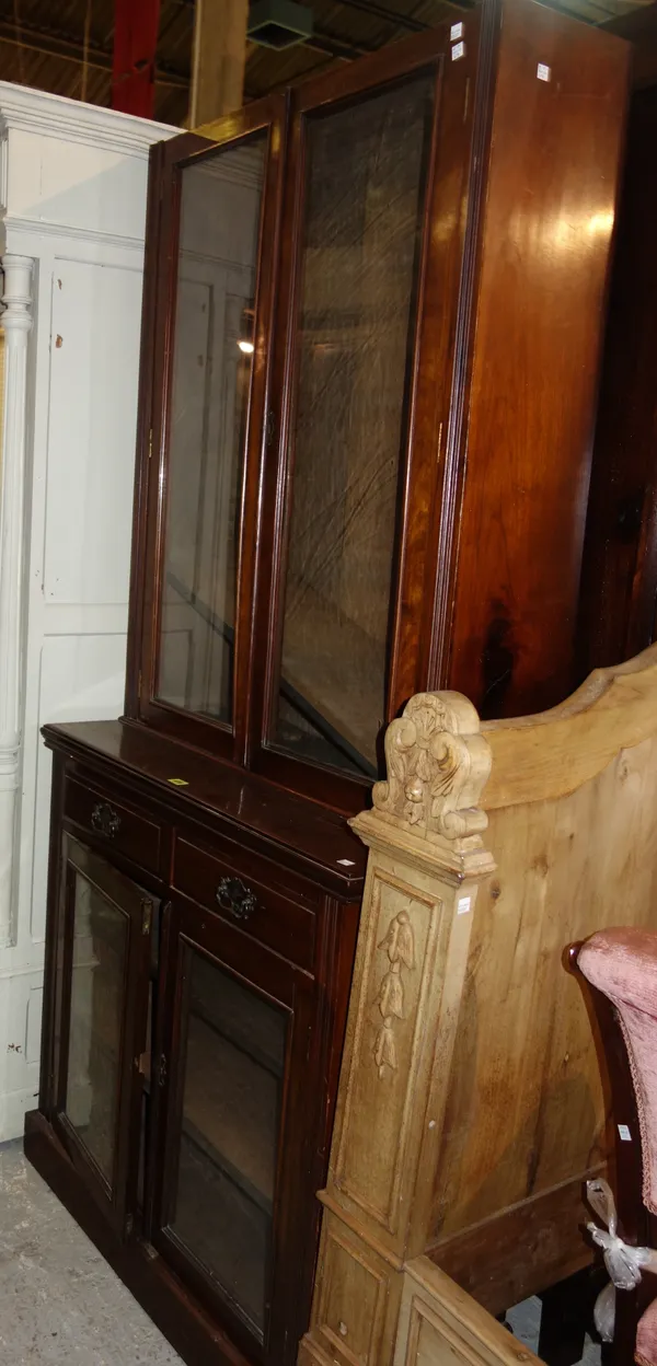 An Edwardian walnut glazed bookcase cabinet, 91cm wide x 201cm high.   M7