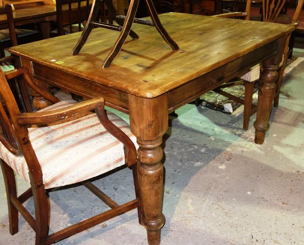 A 19th century stained pine rectangular kitchen table.   I6