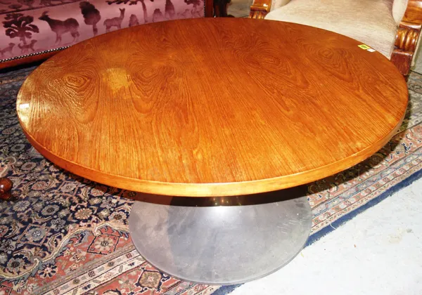 A 20th century oak circular coffee table, with chrome base, 90cm wide x 47cm high.   F4