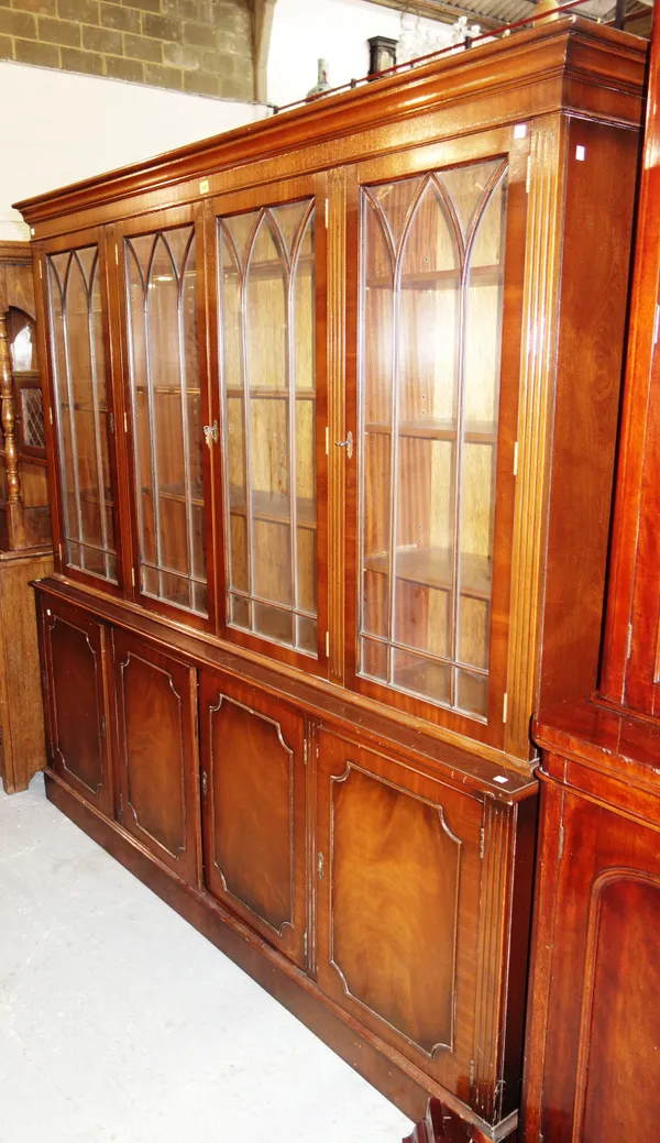 A 20th century mahogany display cabinet, over a three door cupboard base, 195cm wide x 196cm high.   M7