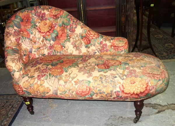 A small 20th century chaise lounge, with floral upholstery, 130cm long.   D3