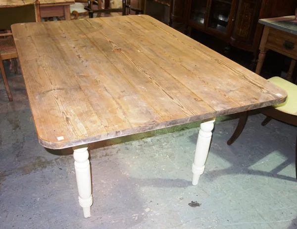 A Victorian and later part stripped pine dining table, 152cm wide x 76cm high.   C4