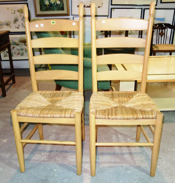 A set of six 20th century ladder back dining chairs, with rush seats, (6).   E6