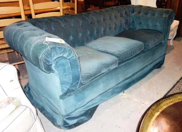 A 19th century mahogany framed chesterfield sofa with blue velvet upholstery.   E6