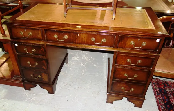 A 20th century mahogany pedestal desk, with leather inset top, 123cm wide x 79cm high.  J8