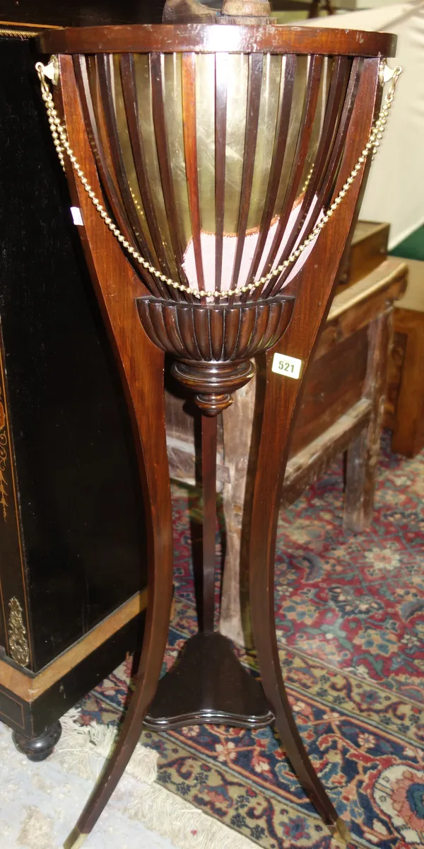 An Edwardian mahogany jardiniere, with slatted body and four splayed supports, 34cm wide x 101cm high.  E4
