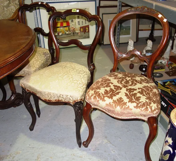 A set of four Victorian walnut balloon back dining chairs and a pair of rosewood lobed back chairs, (6).   E2