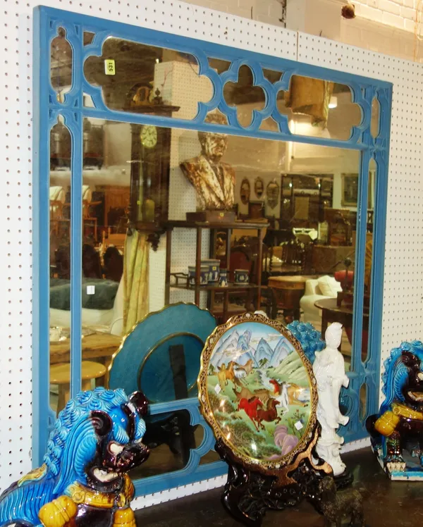 A Gothic style rectangular mirror, covered in blue fabric.  ROST