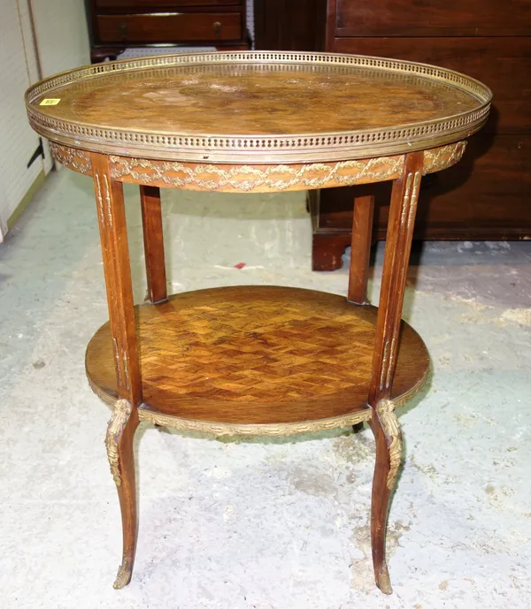 A French parquetry oval two tier table of Louis XV / XVI style.   C8