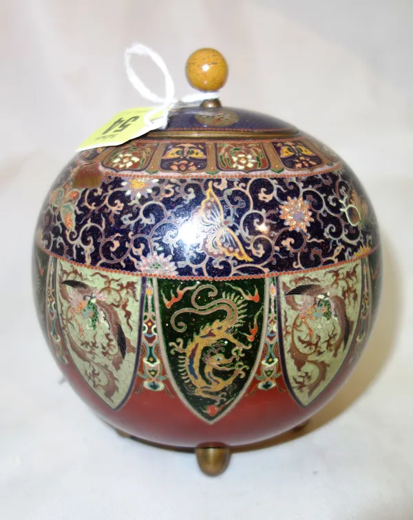 A Japanese cloisonné vase and cover, Meiji period, of flattened bulbous form raised on four short supports, intricately worked with a band of lappets