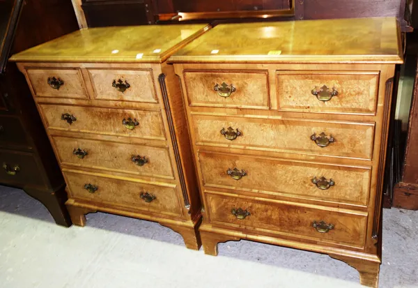 A pair of 20th century walnut chests of two short and three long drawers, each 62cm wide, (2).   D9