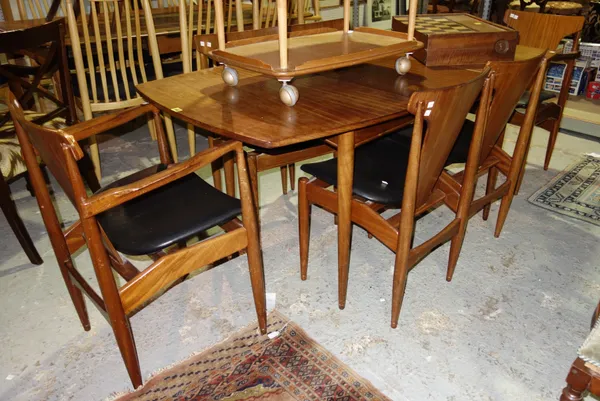 A 20th century retro mahogany dining table, 122cm wide x 73cm high, together with a set of six dining chairs, (7).   H3
