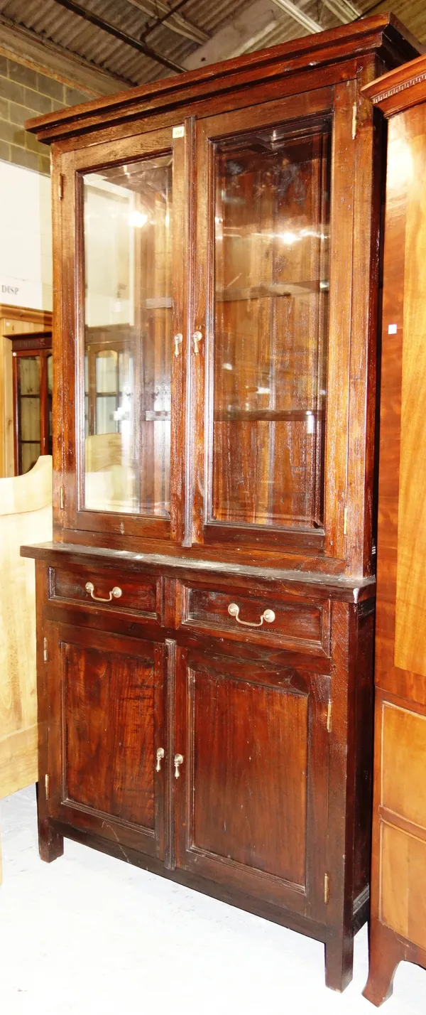 A 20th century hardwood display cabinet, over a two door cupboard base, 104cm wide x 205cm high.L7