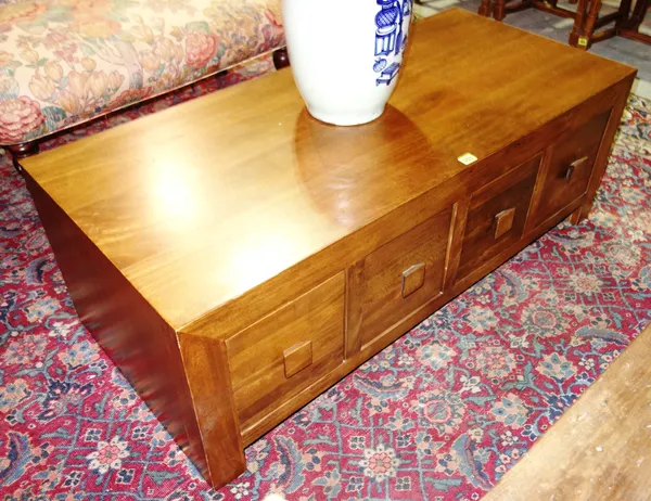 A 20th century hardwood coffee table with four double sided drawers, 123cm wide x 43cm high.  E3