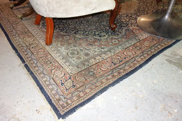 An Indian carpet of Persian design, 280cm x 184cm.   F5