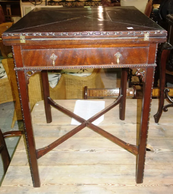 An Edwardian Revival mahogany envelope card table, 56cm wide x 76cm high.    H6