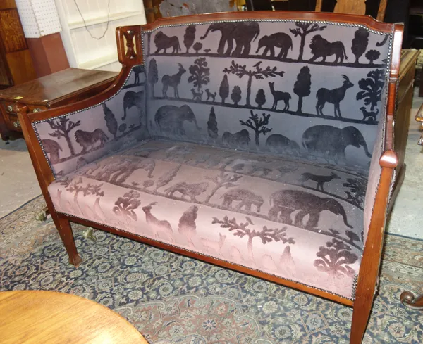 An Edwardian mahogany framed two seat sofa upholstered in purple Andrew Martin animal print fabric.  G5