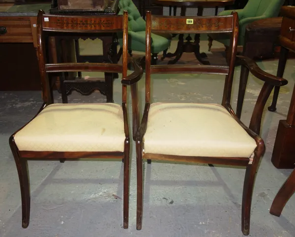 A set of six 20th century Regency style mahogany and brass inlaid dining chairs, to include two carvers, (6).  F8