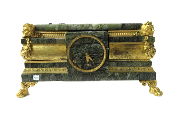 A French green vein marble and ormolu mounted mantel clock, late 19th century, of rectangular form, cast with masks and foliate embellishments, on fou
