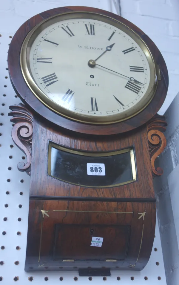 A Victorian rosewood cased drop dial wall clock, the circular nine inch painted tin dial detailed 'W H Howe Clare', with glazed pendulum aperture and