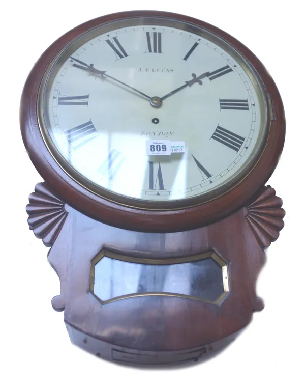 A mahogany cased drop dial wall clock, circa 1900, the 11.5 inch painted tin dial detailed 'J.F LUCAS LONDON', with a glazed pendulum aperture and sin