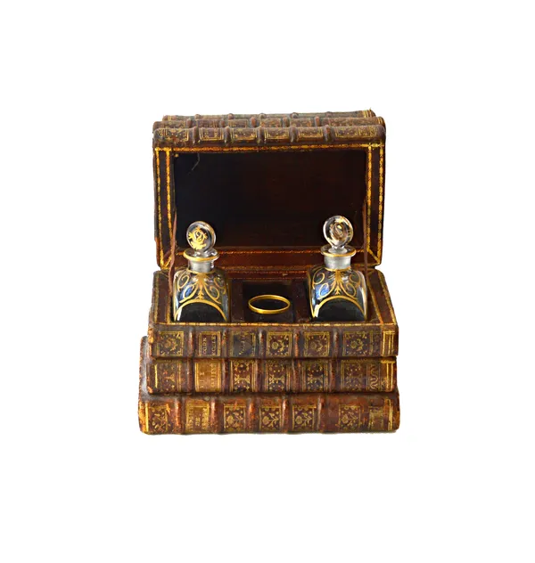 A novelty decanter case, formed as a stack of leather bound Victorian books, opening to reveal two gilt foliate glass decanters and stoppers, and one