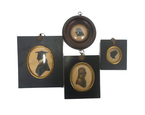 John Field (British, 1772-1848), a silhouette of a gentleman, profile to the right, wearing coat and tied stock, painted on paper and bronzed, signed