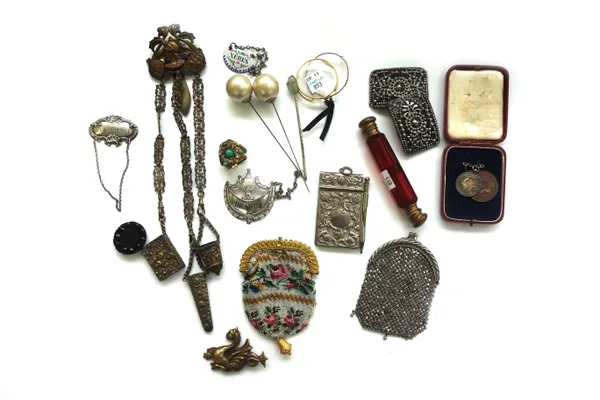 A quantity of small collectables, including; an octagonal ruby glass double ended scent bottle, two silver plated decanter labels, a brass chatelaine,
