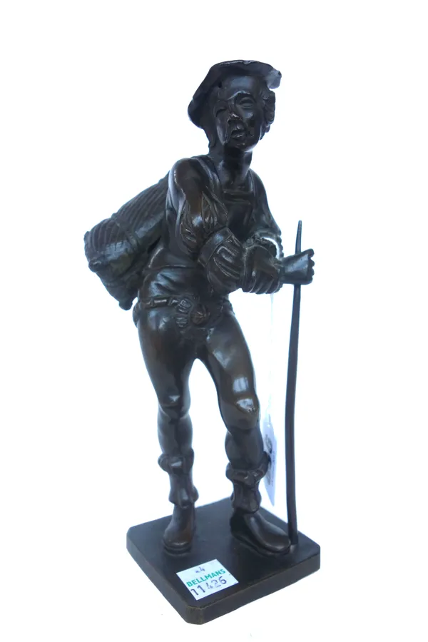 A Continental bronze figure, late 19th century, depicting a Dutch peasant leaning on a staff, unsigned, 19cm high.