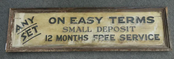 A wooden 'Radio' shop sign, early/mid 20th century, painted pine, with black lettering detailed 'Any set on easy terms, small deposit,12 months free s