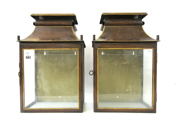 A pair of modern tole peinte wall lanterns, each painted gilt and faux wood, with pagoda top and rectangular glazed body enclosing two electric lights