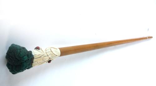 A carved ivory and malachite mounted walking stick handle, late 19th century, foliate carved with colourful ladybirds, on a later hardwood cane, 91cm