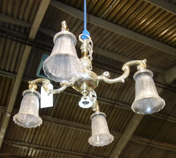 A pair of silvered metal four branch chandeliers, modern, each with baluster stem issuing four scroll branches, supporting cut crystal shades, 44cm hi