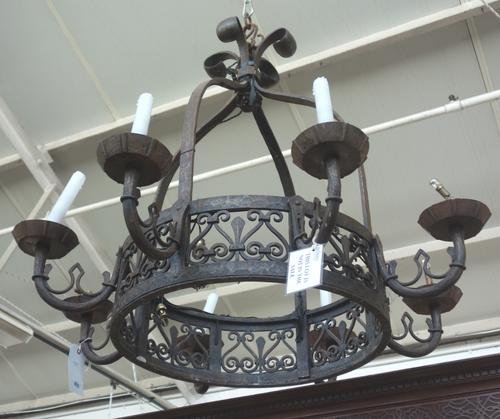 A Victorian Gothic style eight branch chandelier, with a four band open domed frame supporting a pierce circlet, issuing eight branches over an alabas