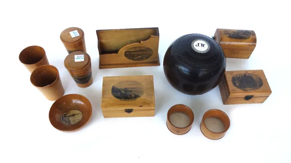 Treen; eleven items of Mauchline ware, early 20th century, including a letter rack from Whiting Bay, Arran, a patch box from Exeter Cathedral, and nin