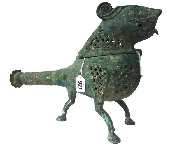 A Persian bronze Khorrasan type censer, modelled and cast as a stylised tiger, with all over foliate pierced decoration, on three shaped feet, 40cm wi