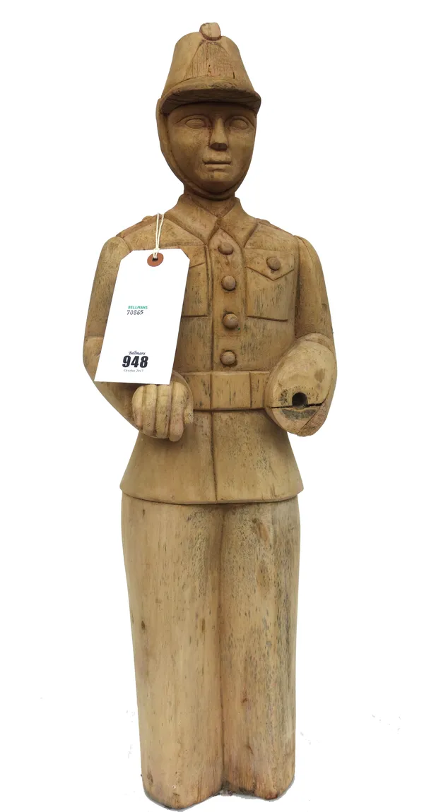 A German fairground pine 'fireman', probably by William Hennecke, circa 1950, previously painted (lacking hand), 66cm high.
