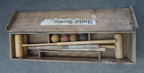 An early/mid 20th century croquet set, comprising; three Jacques mallets, four coloured wooden balls and two marker posts, in a pine case, together wi