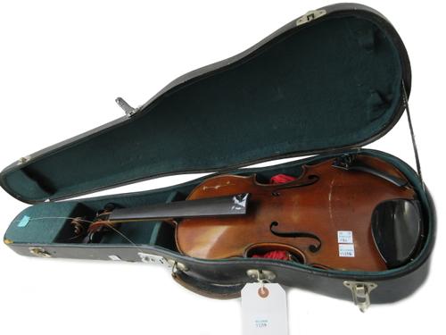 A Continental violin, circa 1900 (lacking interior label), with a two piece striped back and ebony pegs, the back 14.25 inches long (a.f), cased.